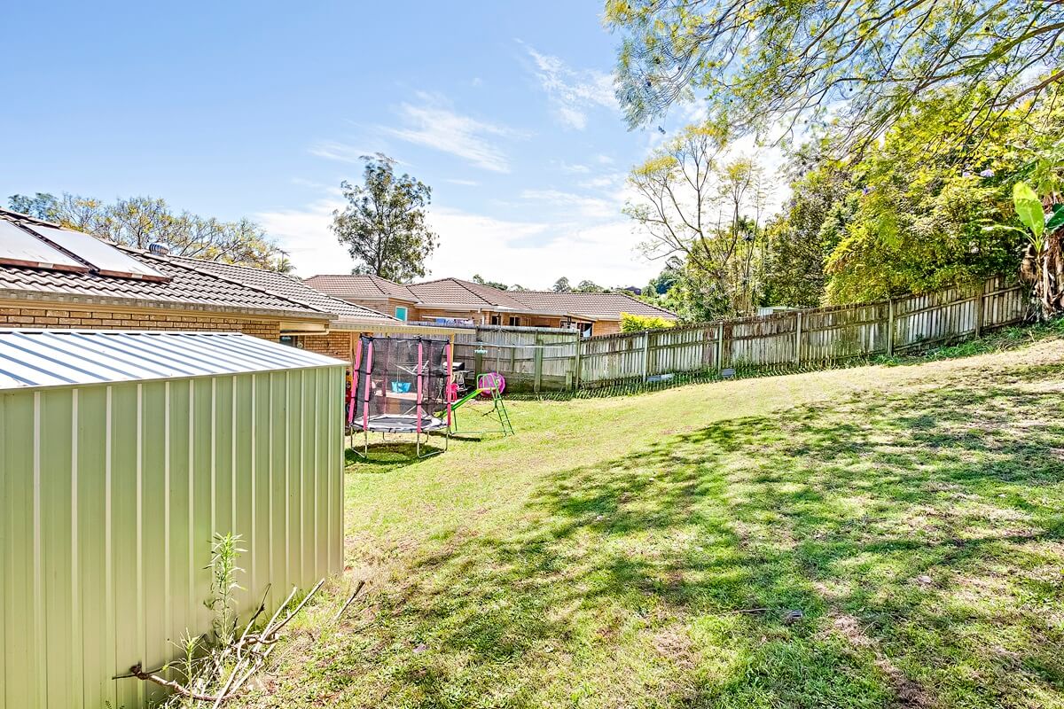 Generous backyard with child play equipment - large blocks in Loganholme need a pre-purchase inspection due to proximity to Logan River